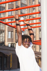 portrait of a happy African-American woman on the street in summer
