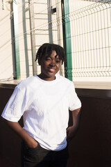 portrait of a happy African-American woman on the street in summer