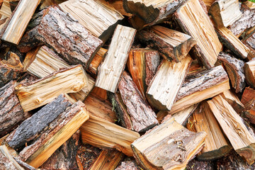Wood chop stove. Woodpile texture background. Trees store. Hardwood pile stack. Wooden biomass wall. Split forest. Agriculture work