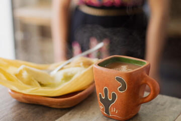 Traditional mexican atole and tamal breakfast