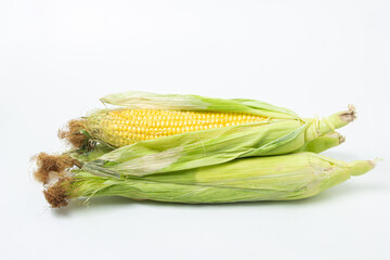 Ear of corn on a white background. Fresh corn on the cob. Healthy food