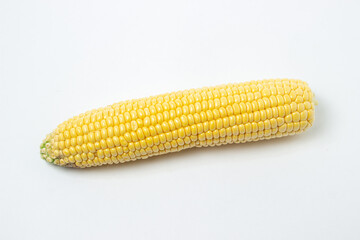 Peeled corn on a white background. Raw fresh corn. Healthy food
