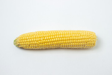 Peeled corn on a white background. Raw fresh corn. Healthy food