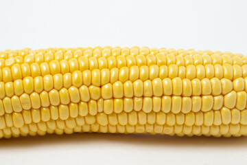 Peeled corn on a white background. Raw fresh corn. Healthy food