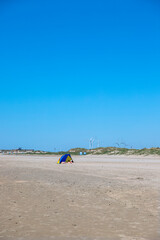 People sleeping in tent at the beach