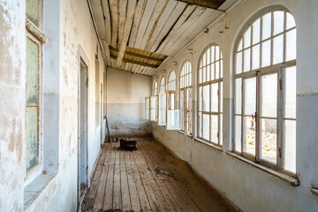Interiors of abandoned building in Kolmanskop, a ghost town near Luderitz in the Namib Desert, Namibia.  