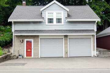 Two Door car Garage with side entrance painted in red.