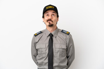 Young caucasian security man isolated on white background and looking up
