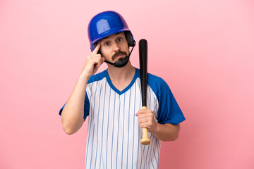 Young caucasian man playing baseball isolated on pink background thinking an idea