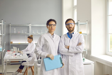 Group of workers in experimental science laboratory. Portrait of medical scientists or biotech...