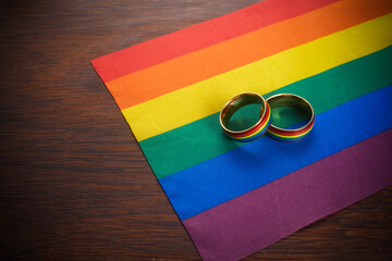 Love wins concept with a multicolored wedding rings. Equality and love protection