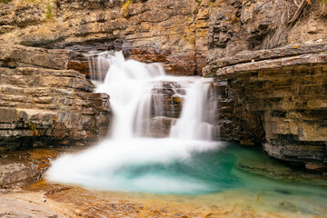 Fototapeta na wymiar The Small Upper Falls in Johnston Canyon, Banff National Park, Alberta, Canada