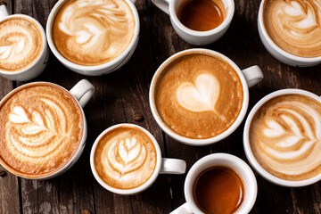 Coffee cups with espresso in them viewed from above showing latte art