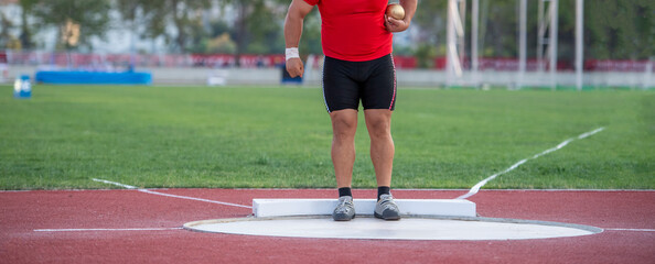 Sportsman practising shot put. Professional sport concept. Horizontal sport poster, greeting cards, headers, website