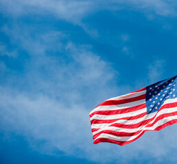 American flag on sky waving in the wind. Horizontal sport poster, greeting cards, headers, website