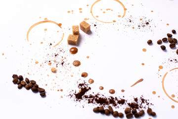 Coffee art, white background, brown sugar cubes, espresso cup trails