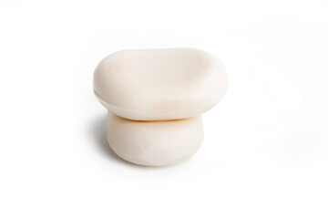 Studio lighting. two pieces of soap on a white background. Close-up.