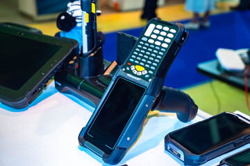 Several terminals for data collection. Data collection terminals close-up. Device for warehouse and sorting works. Device with laser reader. Off screen of data collection terminal. © Grispb