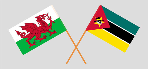 Crossed flags of Wales and Mozambique. Official colors. Correct proportion