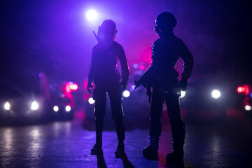 Anti-riot police give signal to be ready. Government power concept. Police in action. Smoke on a...