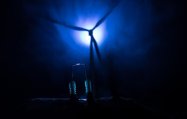 concept idea eco power energy. wind turbine on hill with sunset. Wind Turbine producing alternative energy.