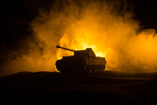 War Concept. Military silhouettes fighting scene on war fog sky background, World War Soldiers Silhouette Below Cloudy Skyline At night. Battle in ruined city. Selective focus