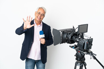 Reporter Middle age Brazilian man holding a microphone and reporting news isolated on white background counting five with fingers