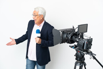 Reporter Middle age Brazilian man holding a microphone and reporting news isolated on white background with surprise expression while looking side