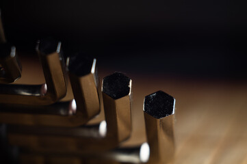 Closeup shot of a set of hexagonal bits, screwing tool