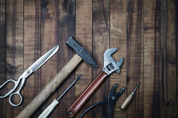 Old work tools on wood table background. Flat lay.