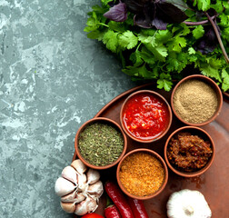  Georgian spices with vegetables on stone background