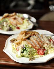 Caesar salad on a clay plate 