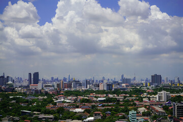 Fototapeta premium view of the city with cloudy sky on blue sky background