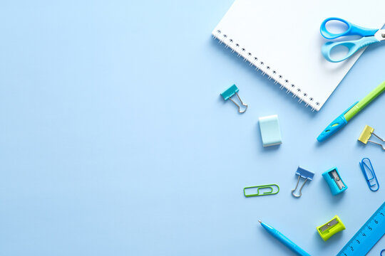 Flat Lay School Stationery On Blue Desk Table. Top View, Overhead. Back To School Concept.