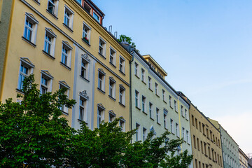 Fototapeta premium orange and white apartment buildings in a row