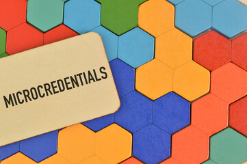 Colorful wooden blocks and label tag written with MICROCREDENTIALS.