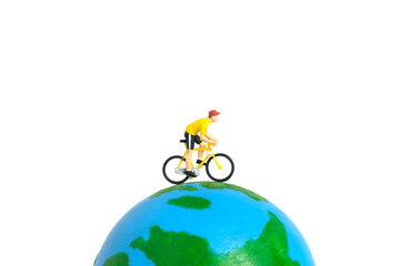 Miniature people toy figure photography. World bicycle day or tour around the world concept. A...