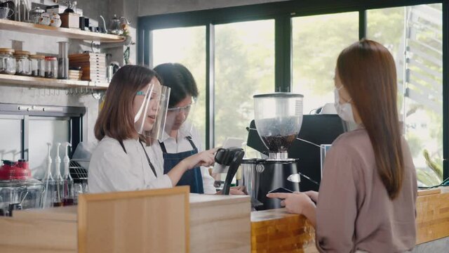 QR code payment, customer woman using digital smartphone application scanning QR code payment without money for buying coffee in cafe coffee shop, small business accepts digital payment