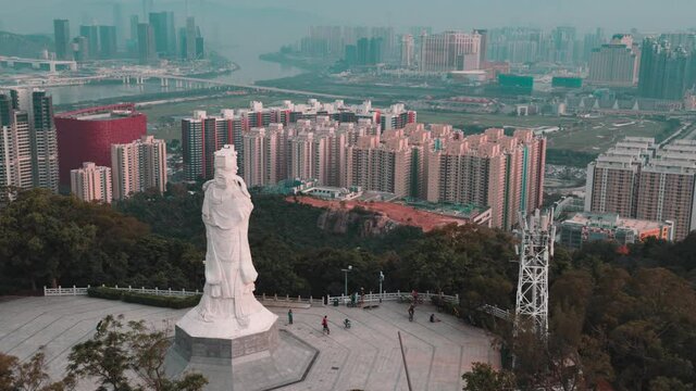 Drone shot of Macau Cotai behind A-Ma Goddess Statue ,
澳門路氹媽祖像
マカオロード, マズの像
마카오 코타이, 마주의 동상