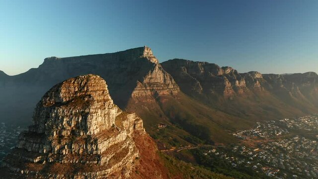 Peak Of The Lion's Head And The Flat Landscape Of The Table Mountains Under Blue Sky In South Africa. aerial