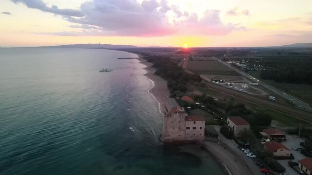 Fast motion overhead aerial view of a drone flying over Tyrrhenian Sea near Follonica and Torre Mozza, Tuscany