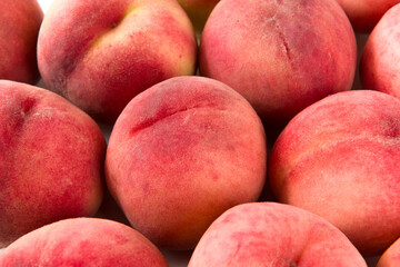 Fototapeta na wymiar Ripe peach fruit close-up on white background
