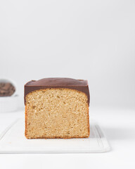 Vanilla pound cake loaf with a dark chocolate glaze topping