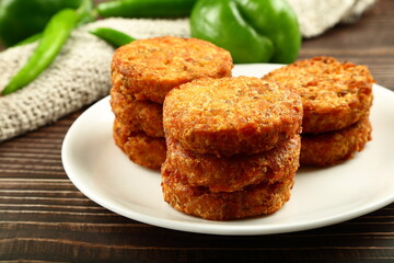 Homemade delicious chicken cutlets served in ceramic plate.