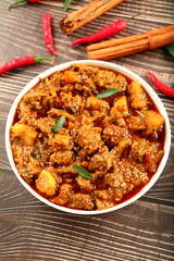 Bowl of  spicy Indian beef roast ,curry. traditional cooking recipes background.