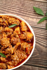 Bowl of  spicy Indian beef roast ,curry. traditional cooking recipes background.