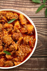Homemade delicious mutton curry, roast., chops served in ceramic bowl, Indian cuisine .