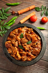 Kerala mutton curry roast- cooked in earthenware, clay pottery, traditional Malabar recipes.