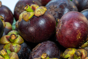 Top view Rotate Mango Steen fruit on wooden table.