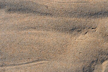 Fine luminous sand patterns in the beach of Matosinhos